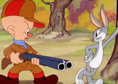 Elmer Fudd Pointing Gun At Bugs Bunny